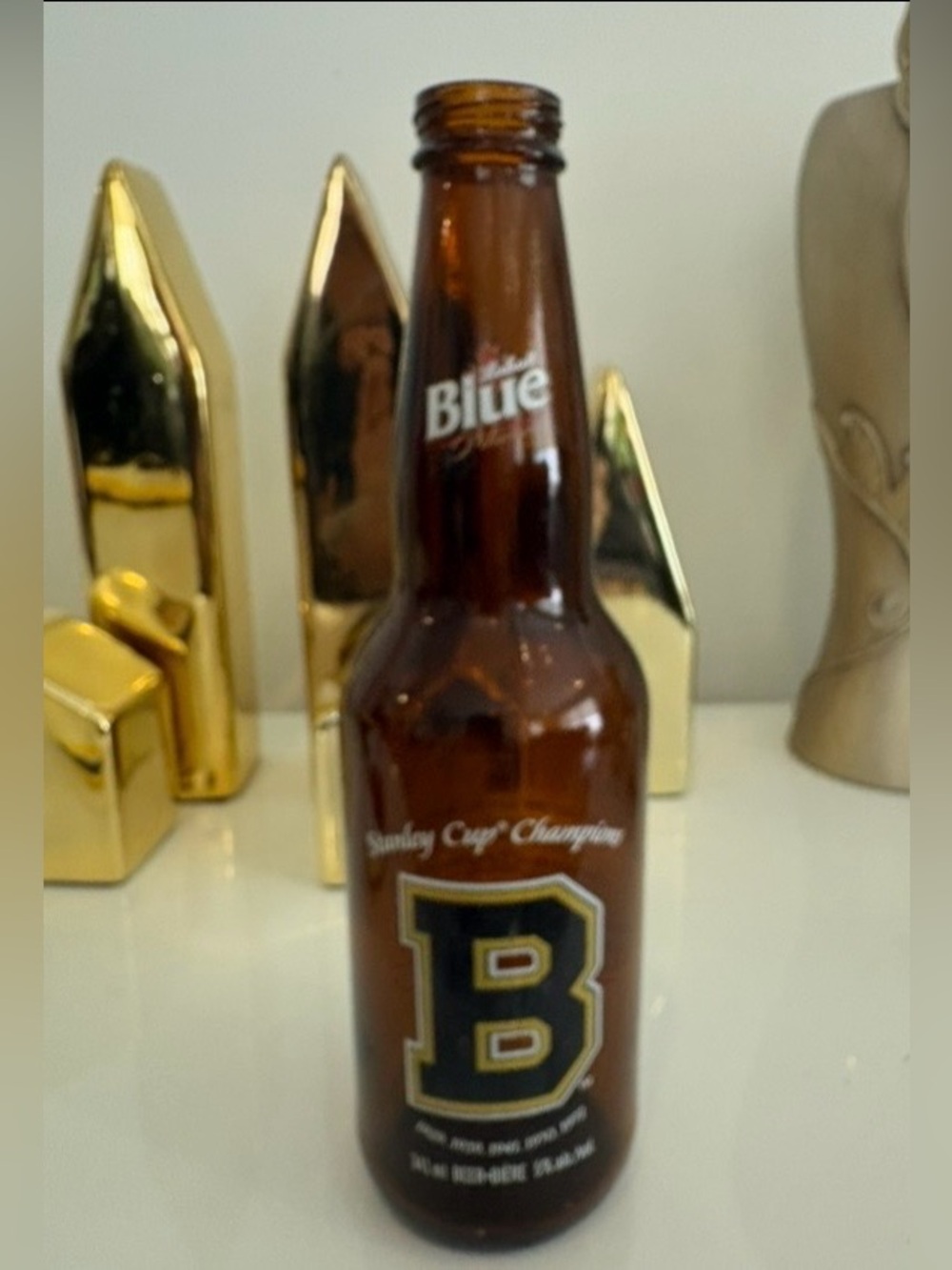 Labatt Blue Boston Bruins Amber Glass Beer Bottle with Black & Gold 'B' Logo